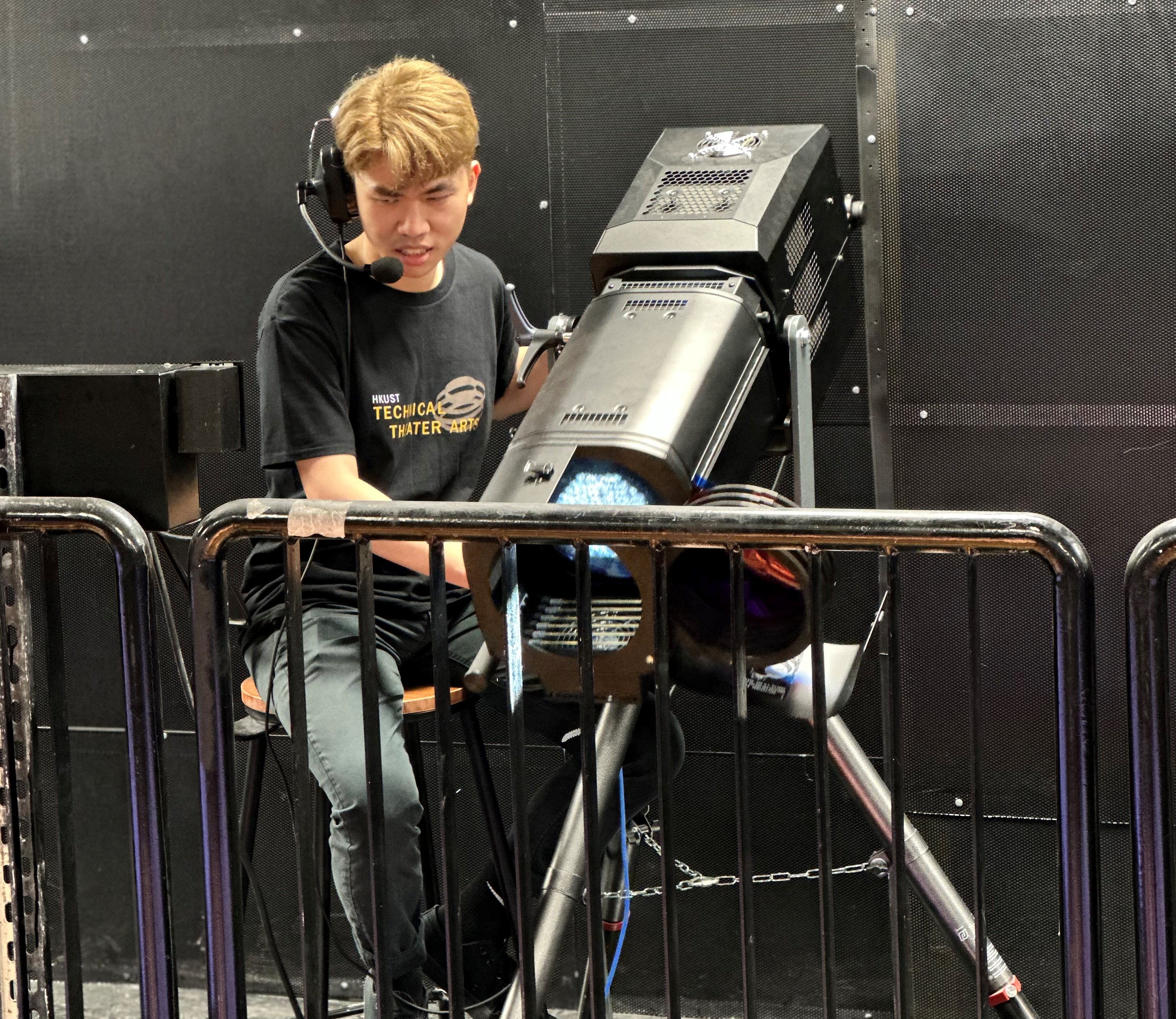 HKUST student is controlling the spot light in the Shaw Auditorium