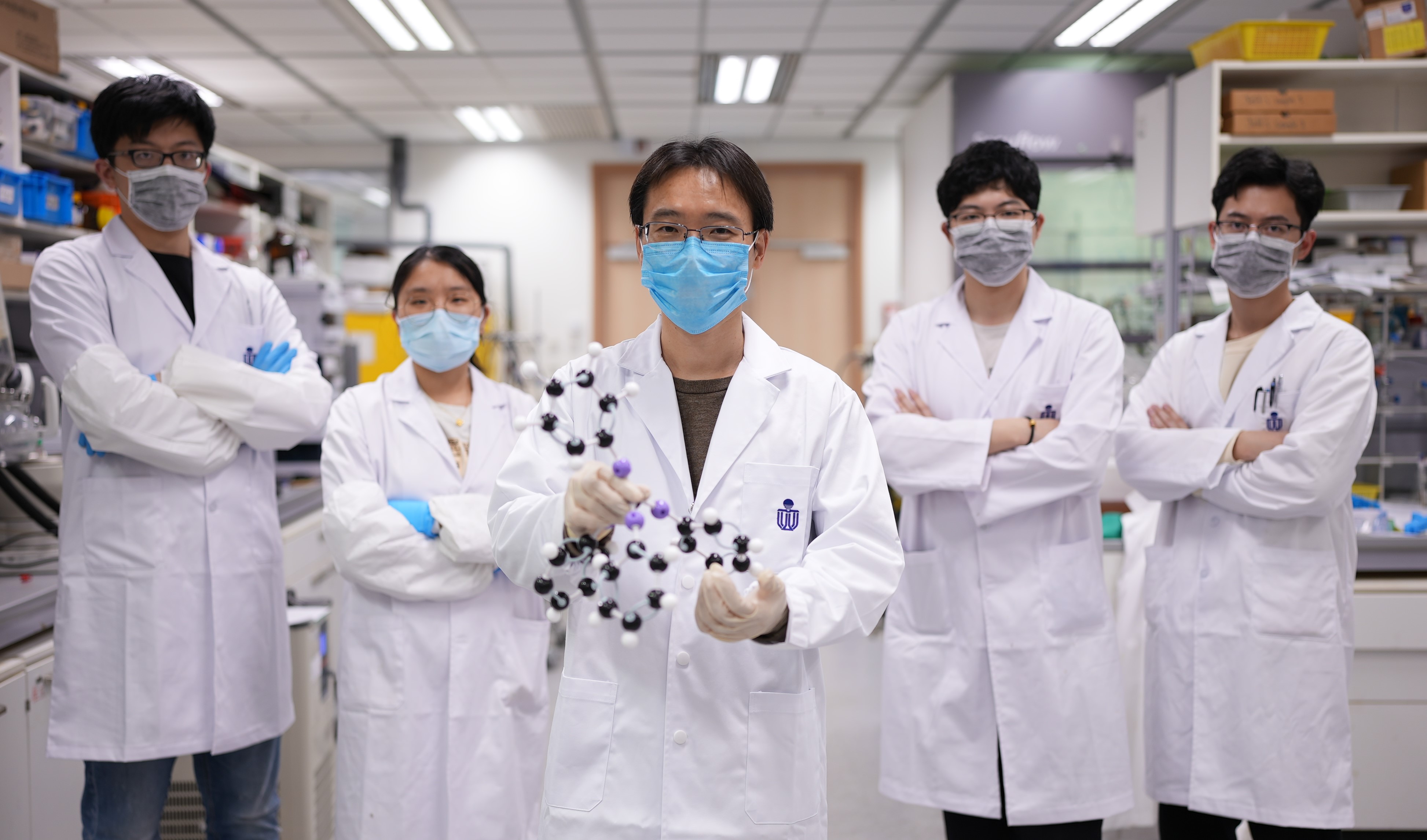 Prof. Sun (middle) and his research team