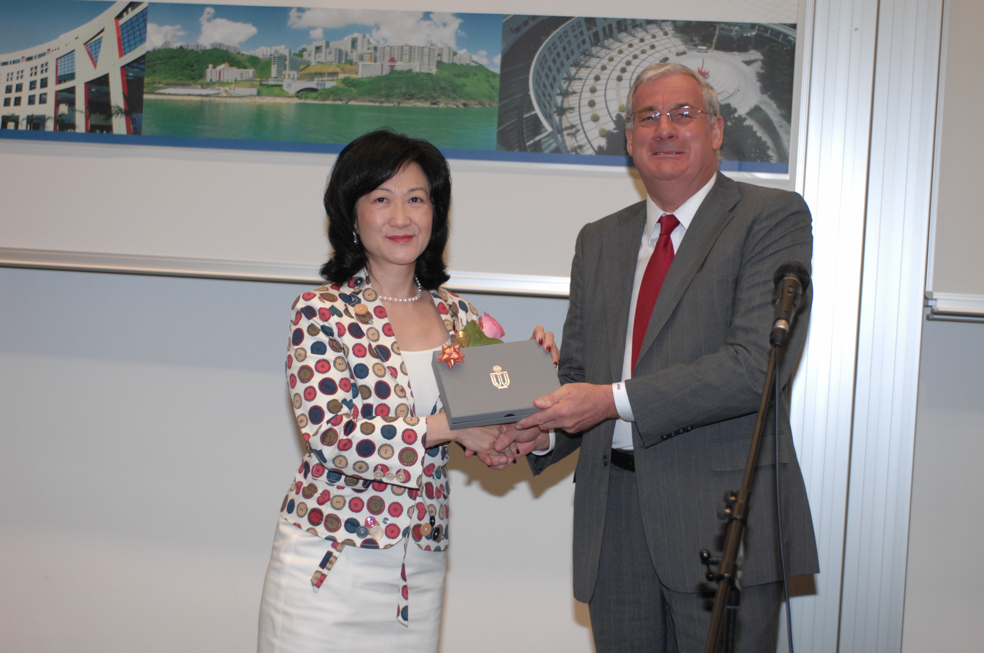 Prof Tony Eastham presents thank-you souvenir to Guest of Honor Mrs Regina Ip.	
