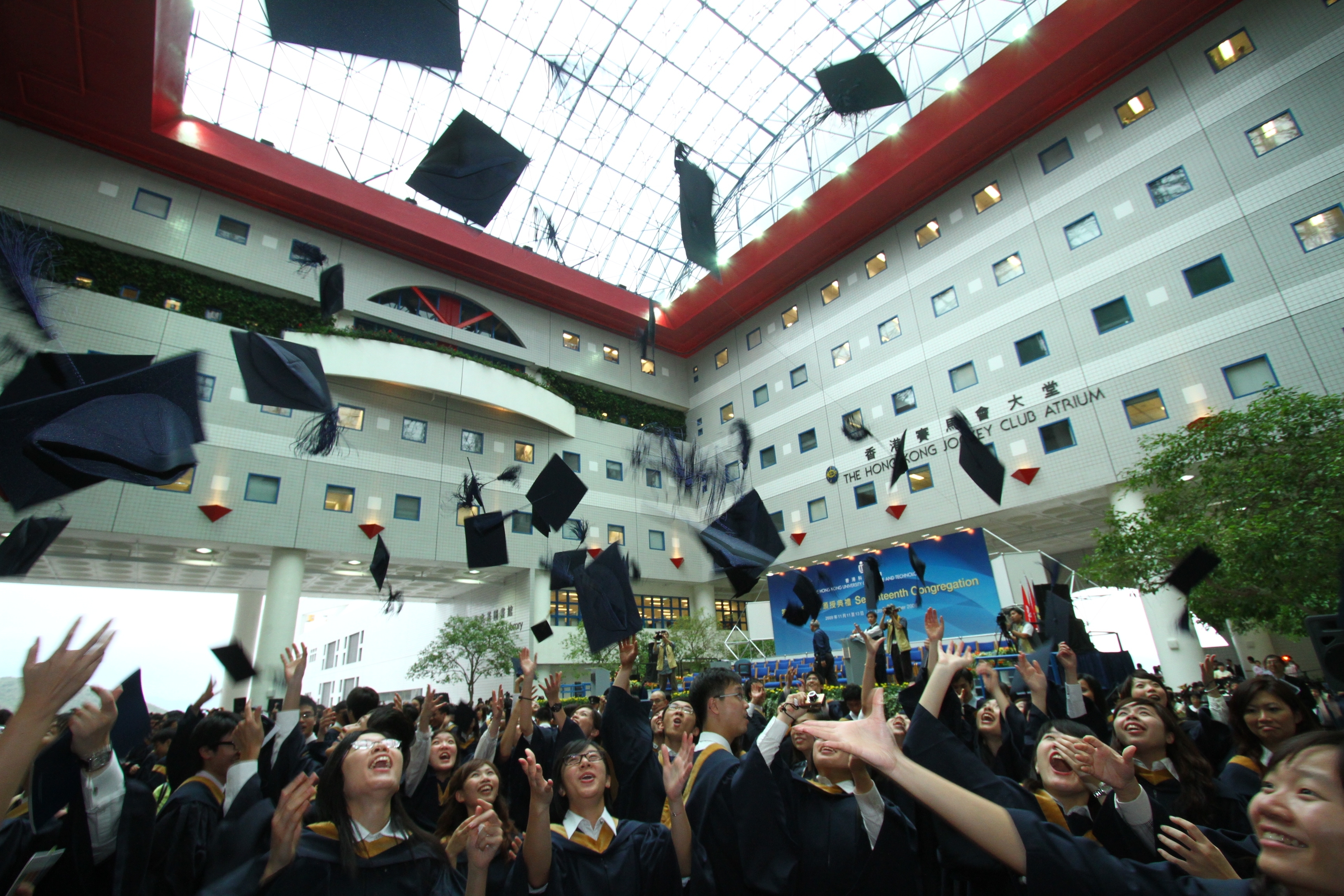  Graduates tossing their hats in jubilation as the Congregation concludes.