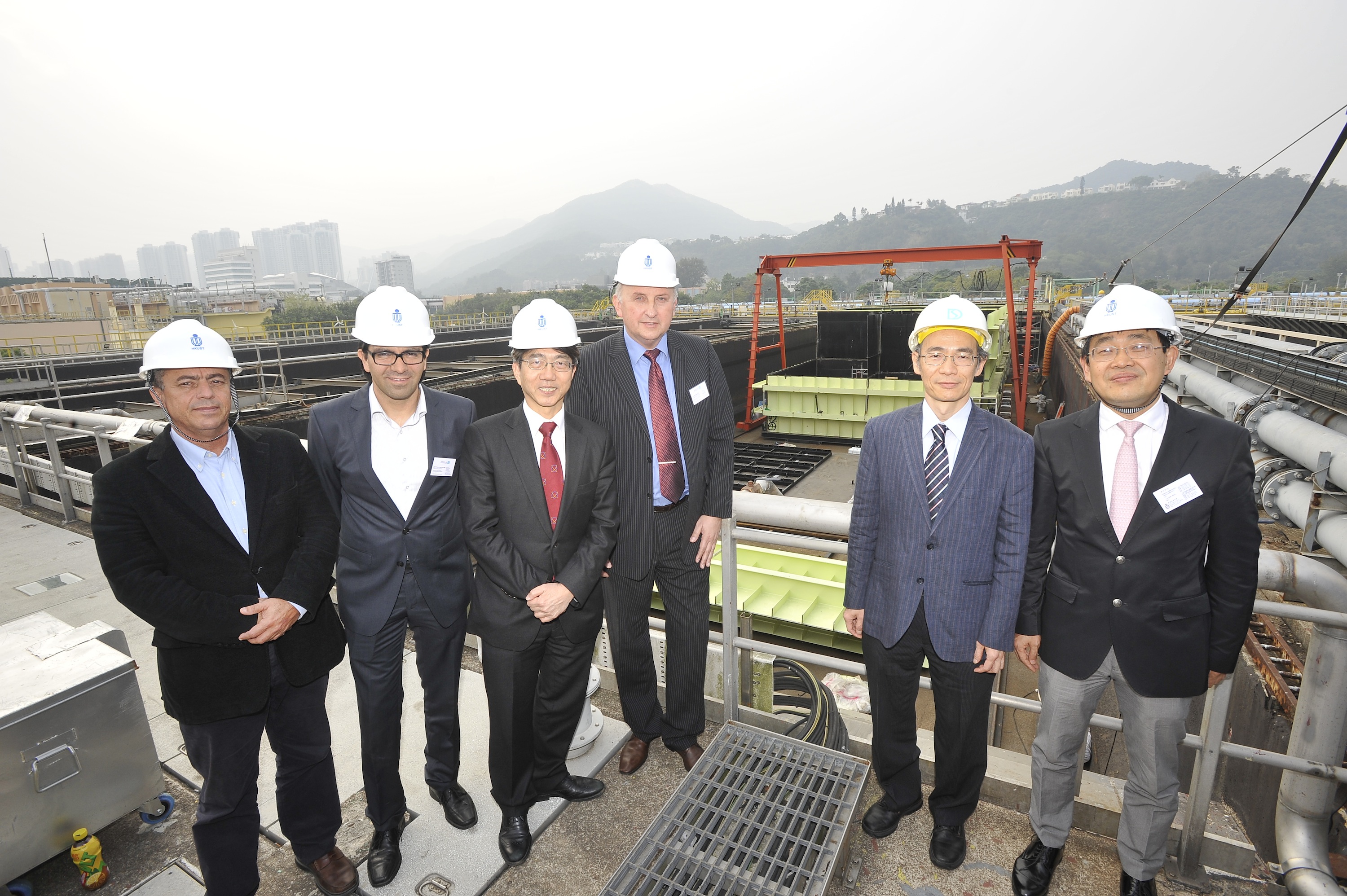  The consortium partners, joined by Mr Wing-cheong Fung (second from right), Senior Electrical &amp; Mechanical Engineer, Electrical &amp; Mechanical Projects Division of the Drainage Services Department, visit the SANI Sewage Treatment Plant at the Shatin Sewage Treatment Works.