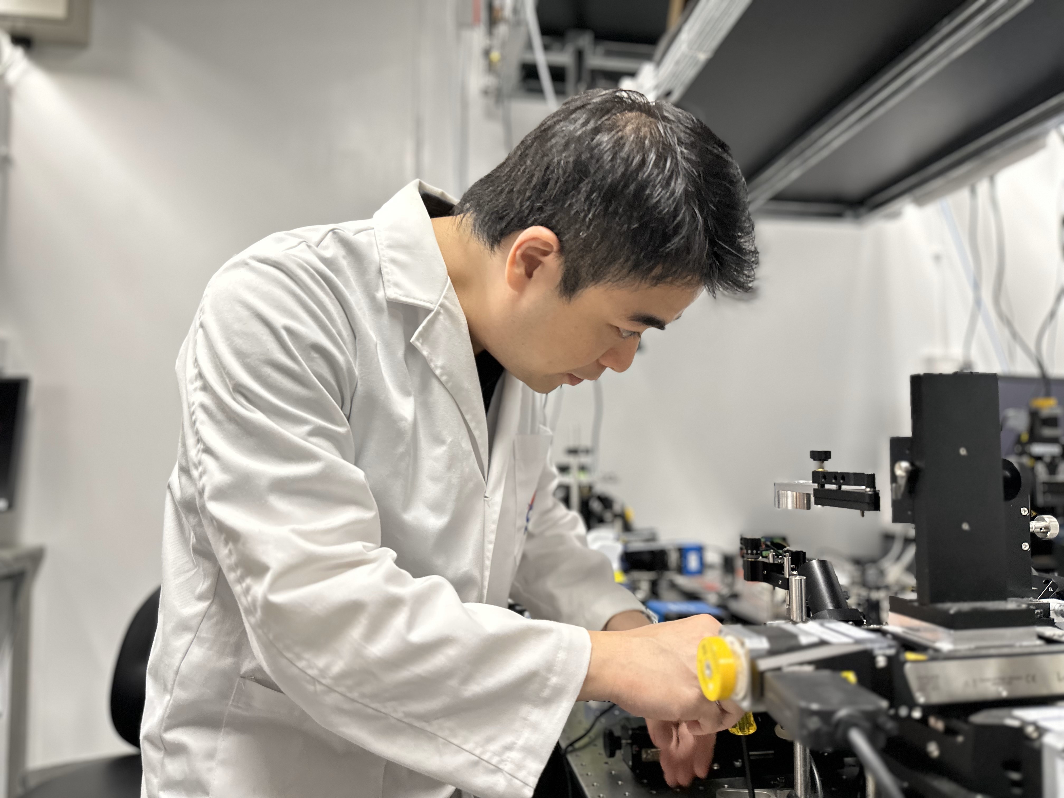 Prof Terence Wong working with CHAMP microscope