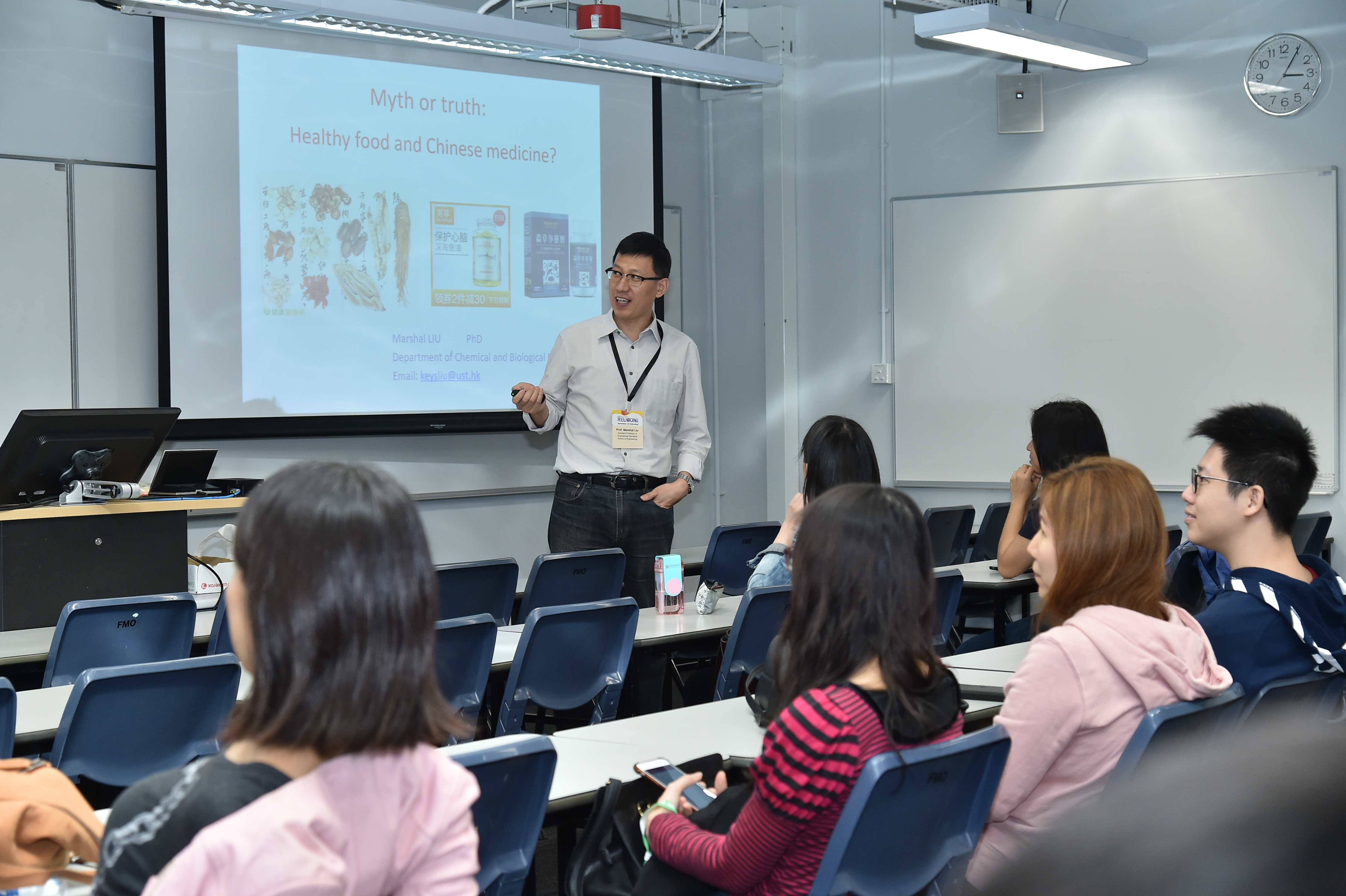 Prof. Liu (center) typically opens the course with a sobering slide entitled “Which of the following is wrong?” with dozens of statements of popular or cultural health beliefs.