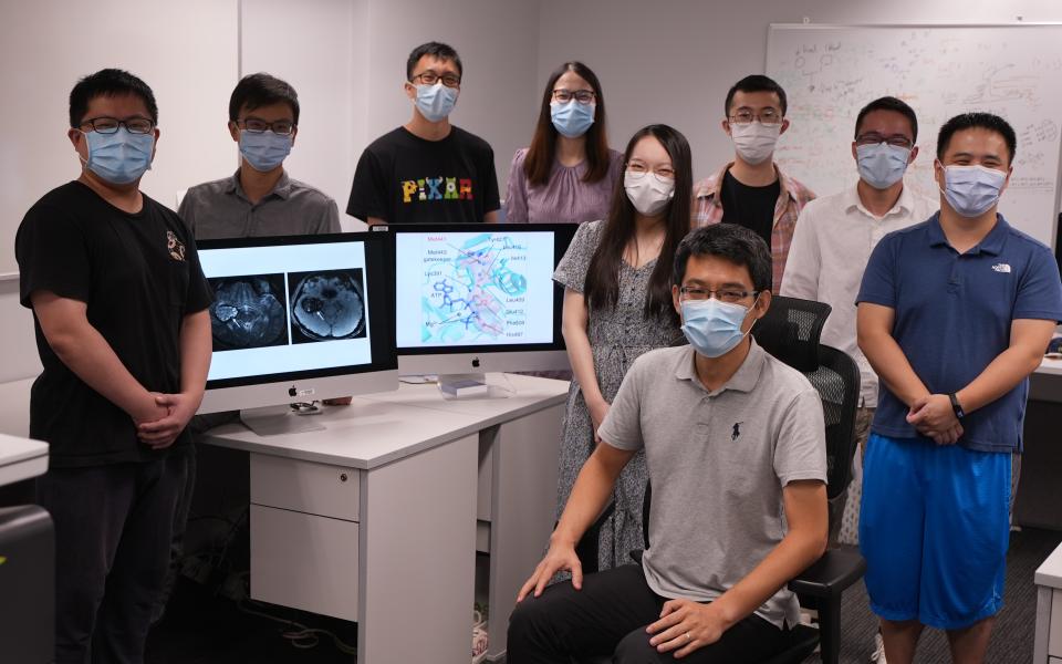 Prof. WANG Jiguang (front, seated) and his research team