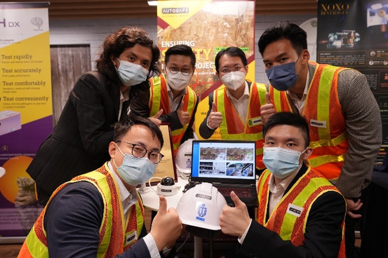 The winning team of the Sino-HKUST One Million Dollar Entrepreneurship Competition founded AutoSafe, an AI solution company leveraging smart technology to modernize and automate worksite safety monitoring while improving efficiency. In the photo: Issac LEUNG, co-founder (first left, back row), Prof. Jack CHENG (second right, back row), and Peter WONG, co-founder (first right, front row).